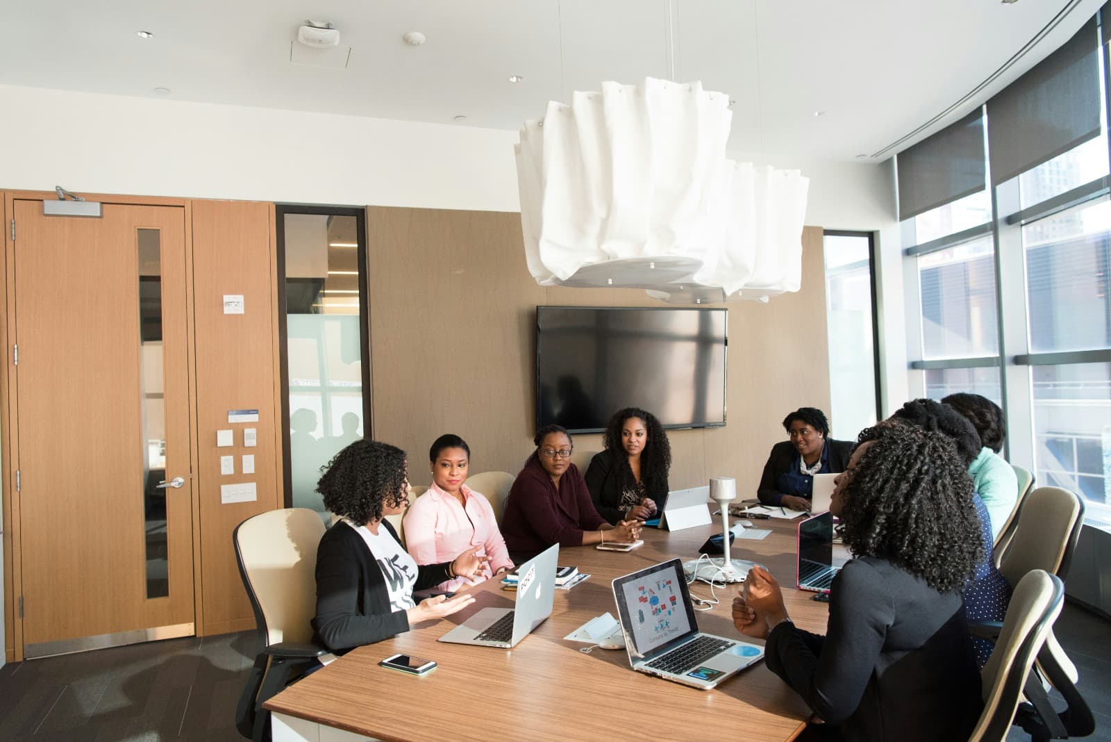 Partners aligned in a working session — one process from conversation to close